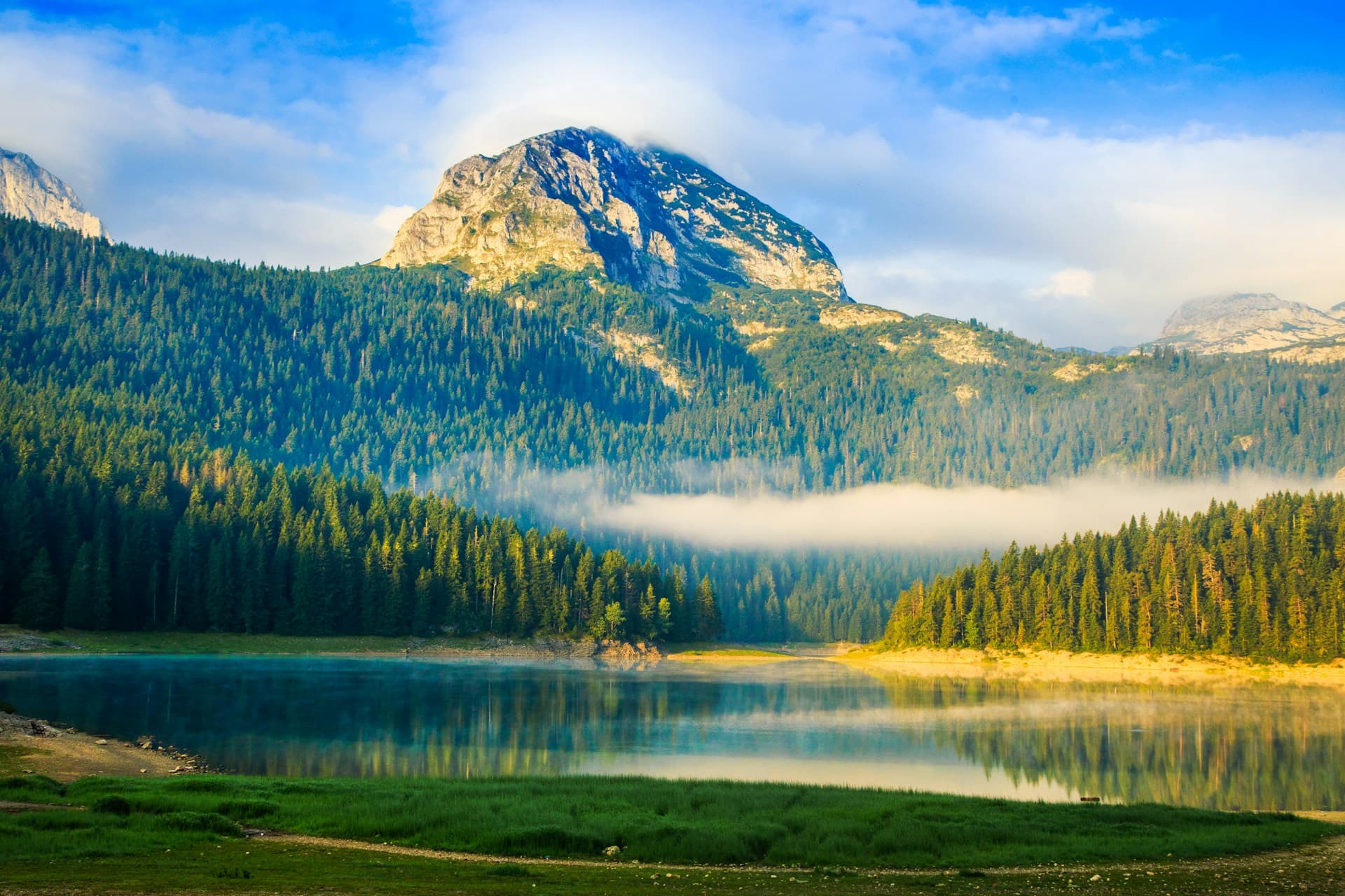 Black Lake beneath the Durmitor peaks in Montenegro at dawn