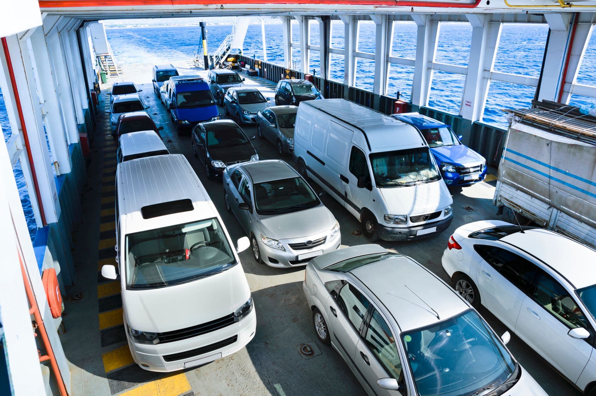 Cars packed onto the open deck of an island ferry