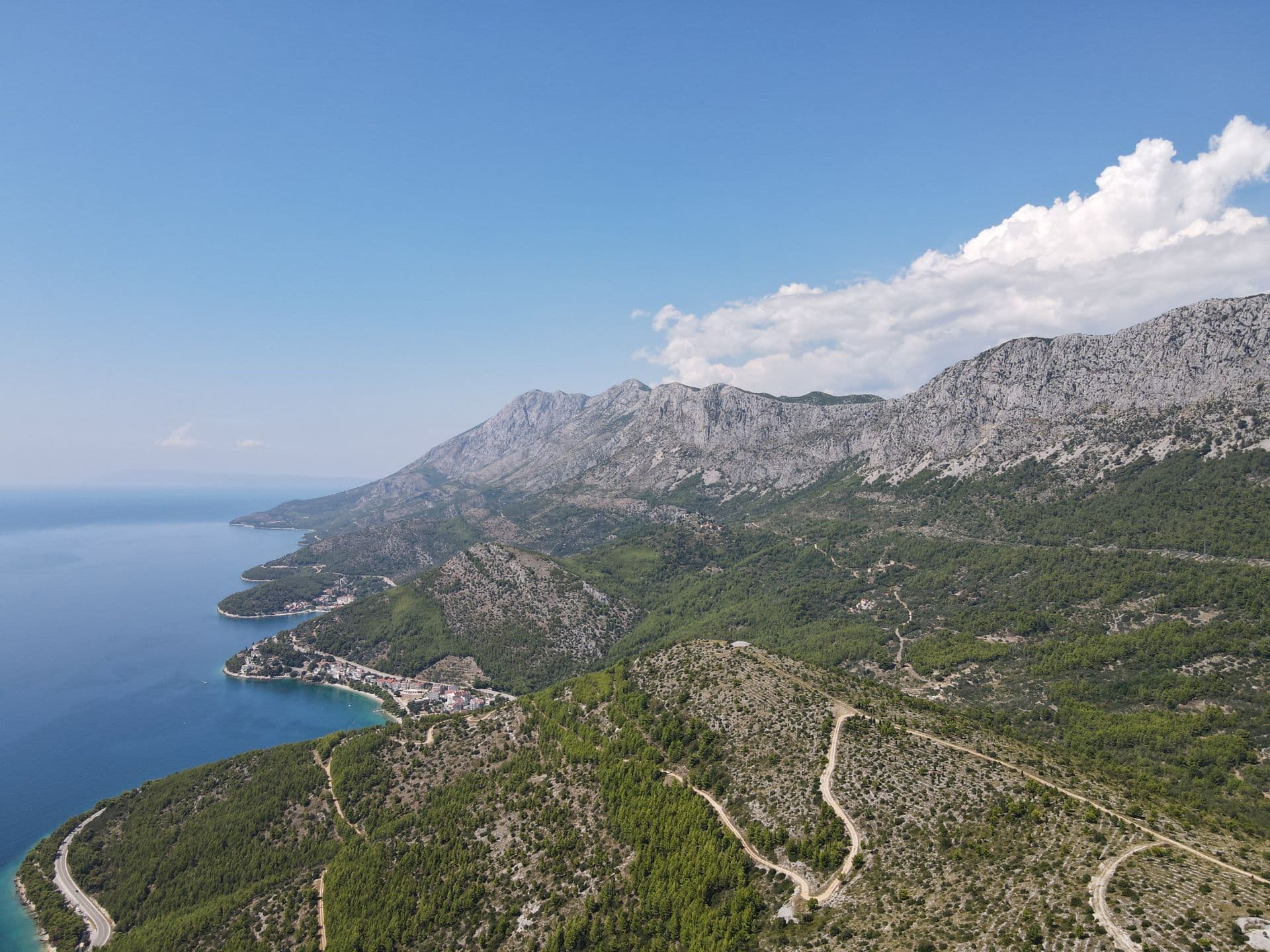 The coast road under the Biokovo massif on the Makarska Riviera, from above