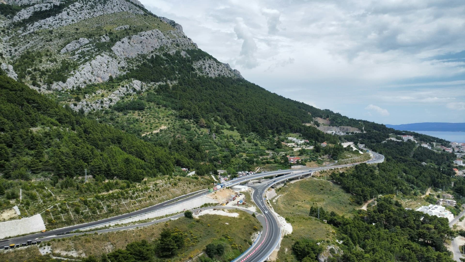 The coast highway winding through the hills above the Adriatic, seen from above